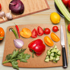 Belwares natural flat composite cutting board used for vegetable preparation